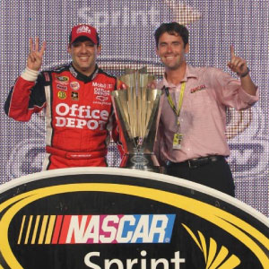 Brandon Suggs in Victory Lane with Tony Stewart following Cup Championship