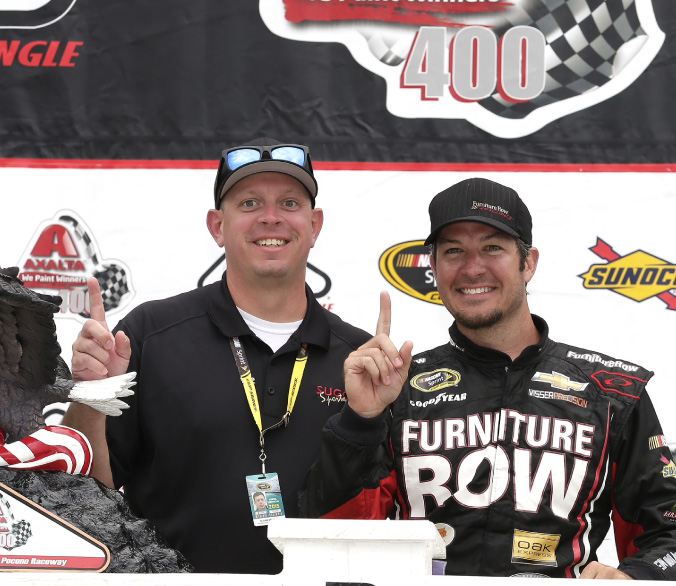 SSM team member Blaine Sellers with Martin Truex in Victory Lane